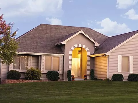 House with tan insulated siding